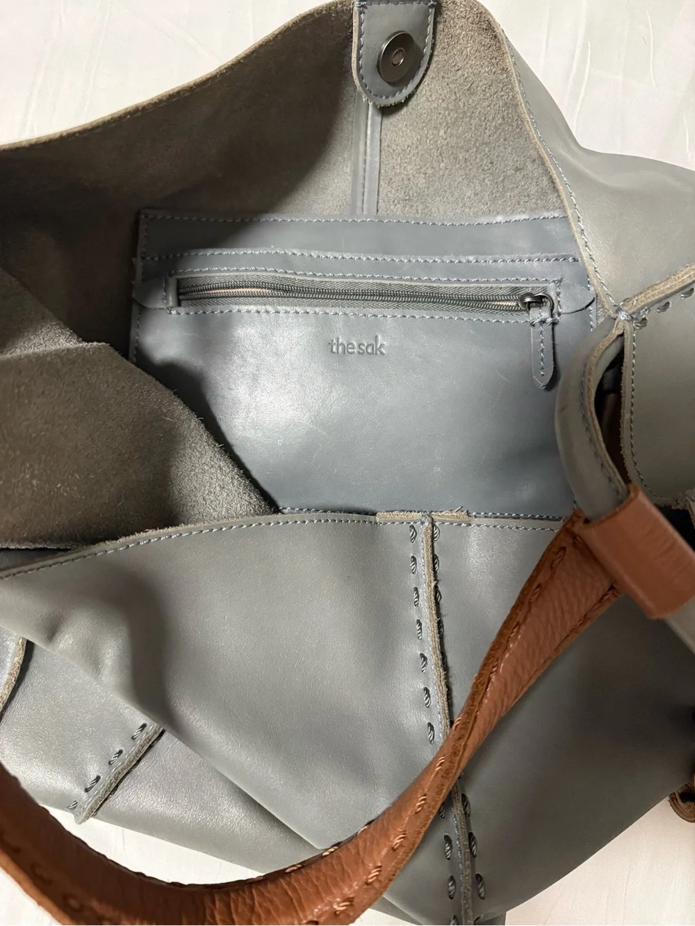 The Sak Gray Leather Hobo Shoulder Bag with Brown Strap and Tassels